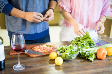 Close up of couple making food in kitchen