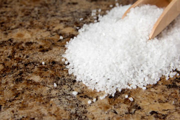 Salt on a brown marble background.