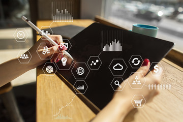 Business and technology concept. Graphs and icons on virtual screen background.