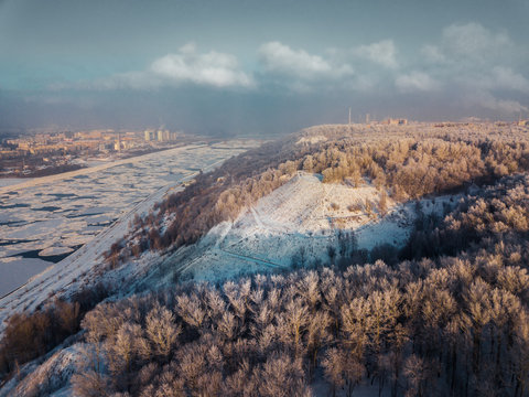 City of Nizhny Novgorod from a height in a frosty day with a forest in the frost