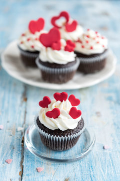 Sweet homemade cupcakes with hearts on the top,valentines day concept and selrctive focus