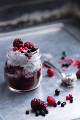 Chia pudding with yogurt and berries in glass jar