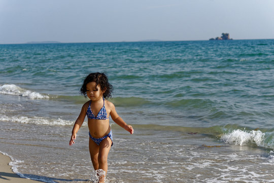 little girl on the beach in summer Thailand
