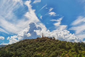 The Virgin Mary statue on the mountain top outside the village Viviers in the Ardeche region of France