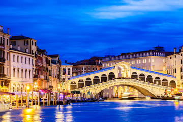 Venice, Italy. Rialto bridge and Grand Canal at twilight blue hour. Tourism and travel concept.