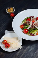 Close up of plate with fresh tasty salad