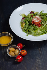 Close up of salmon salad with fresh vegetables