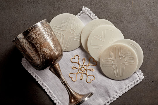 Silver chalice cup and Sacramental bread
