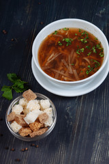 Top view of tasty soup served with crackers