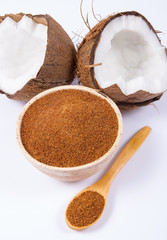 Coconut with coconut sugar isolated on white background.