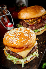 Traditional beef burger or cheeseburger on a bun