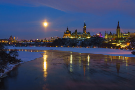 Ottawa skyline in winter under full moon