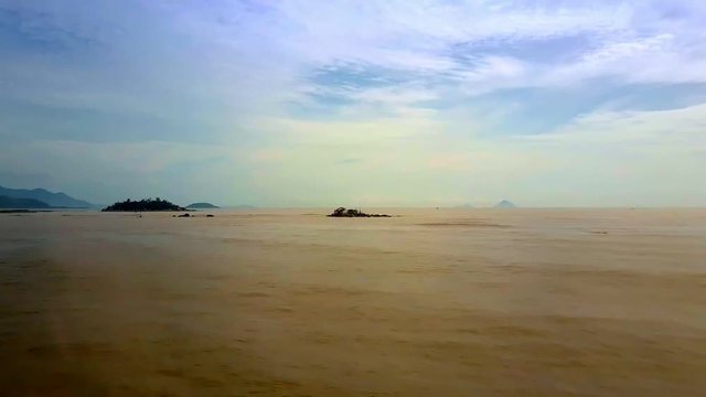 Sea Filled with Clayey Rocks under Pictorial Sky Upper View