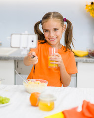 Little girl make selfie on kitchen