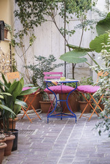 Fototapeta na wymiar Colorful chairs and table on balcony