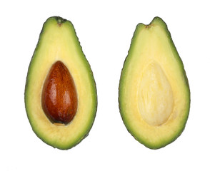 whole and half avocado isolated on white background close-up. Top view. Flat lay pattern