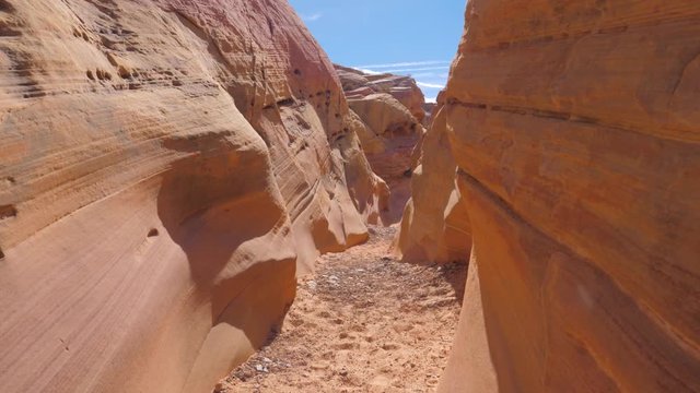 Camera Movement On A Dry Gorge With Smooth And Wavy Rocks Of The Red Canyon 4K