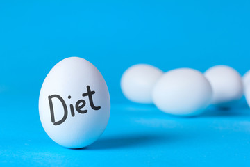 Egg diet for weight loss. Cleaning the body of toxins. Full healthy breakfast. On the egg the word diet, blue background
