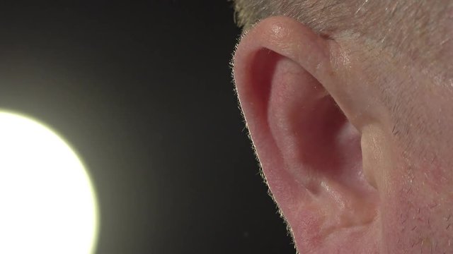 Close up of man's ear with visuable pulse