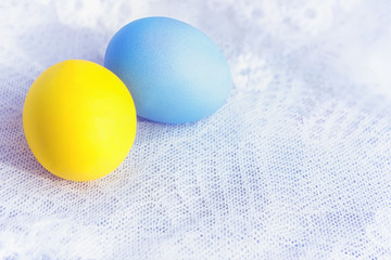 Two Painted Eggs On A Lace