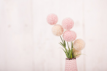 Flowers composition for Valentine's, Mother's or Women's Day. Pink flowers on old white wooden background.