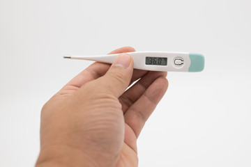 The hand holding the digital thermometer
