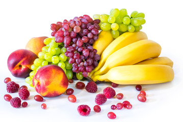 Still life with banana, grape and nectarine on white