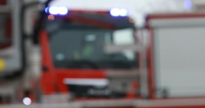 Firefighter or fireman fiting with fire on home.