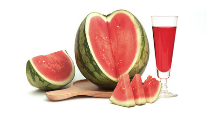 Watermelon Round, Green, Close Up, Sliced, See in Red, Dropped on Wooden Tray with Red Glass, White Background.