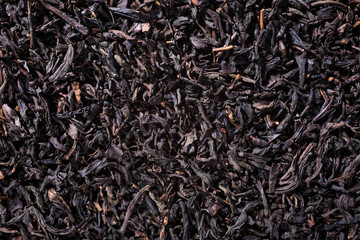 Background with black tea with copy space. Top view.