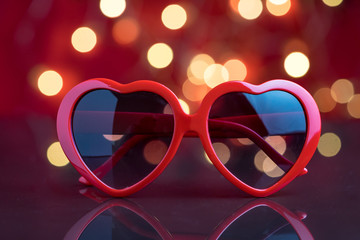Heart shape eyeglasses with decoration light bokeh background as Valentine's day party concept