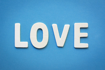 Love word on blue background, concept valentine's day