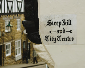 Painted Sign Directing Pedestrians to Steep Hill and the City Centre in the English city of Lincoln, Shallow Depth of Field Split Toning Photography - 189053583