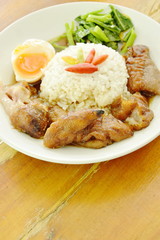 braised pork trotters and boiled egg with rice on plate