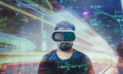 Guy looking through VR (Virtual Reality) glasses - Virtual World