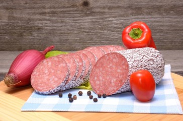  sliced meat sausage salami on wooden board