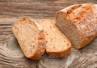 fresh bread and wheat on the wooden
