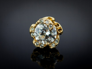 Diamond earring on gradient black background
