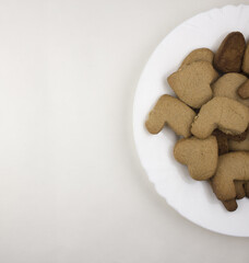 Biscuits love on a white plate and against a white background