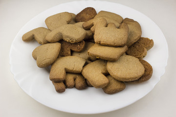 .Biscuits love on a white plate and against a white background
