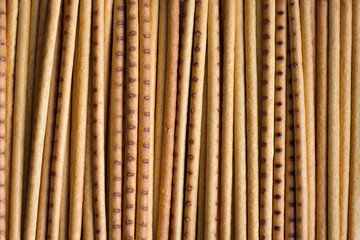 biscuits in the form of long thin straws of yellow and brown color