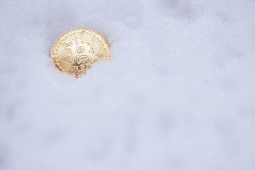 Bitcoin on the snow. Isolated on white background.