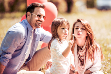  Young family with child  having fun in nature.