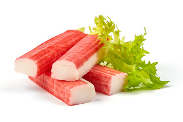 Red sea crab stick with green lettuce, close-up, isolated on white background. - obrazy, fototapety, plakaty