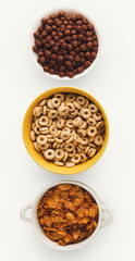 Set of bowls with quick breakfast cereals, isolated