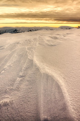 Winter snowy landscape at sunset, nature background.