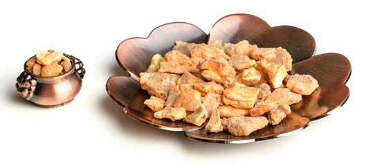 styrax benzoin in the plate, on the white background, isolated