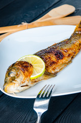 Fried fish served on the plate