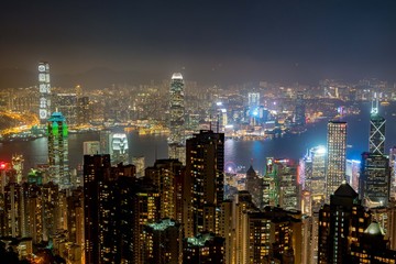 Fototapeta na wymiar Hong Kong tower on sundown bird eye view from kowloon at victoria peak tower the famous view point of hongkong