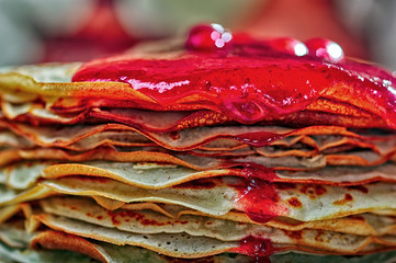 Close-up pancakes and red jam.